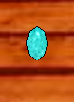 A large cabochon turquoise on a wall.